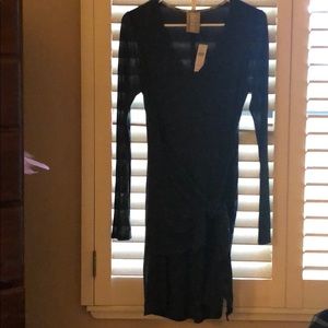 Long sleeve dark green wrap dress .